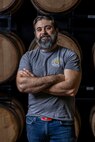 U.S. Air Force Master Sgt. Matthew Elder, Special Warfare Training Wing readiness flight chief, poses for a photo at a distillery where he is performing his SkillBridge internship in San Antonio, Texas, May 10, 2024. The DOD SkillBridge Program allows separating service members to intern with approved industry partners for up to 180 days prior to their separation date as long as the obtain their chain of command approval. The program is designed to give service members valuable industry experience and help smooth the transition between military and civilian life. Elder used his SkillBridge benefit to explore career opportunities in the distilling and beverage industry. (U.S. Air Force photo by Ismael Ortega)