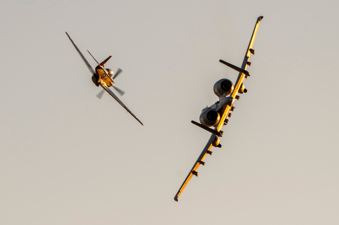 Air Force Maj. Lindsay Johnson, A-10C Thunderbolt II Demonstration Team commander and pilot, performs a break maneuver with a P-51 Mustang during a heritage flight demonstration at Davis-Monthan Air Force Base, Ariz., Nov. 1, 2024.