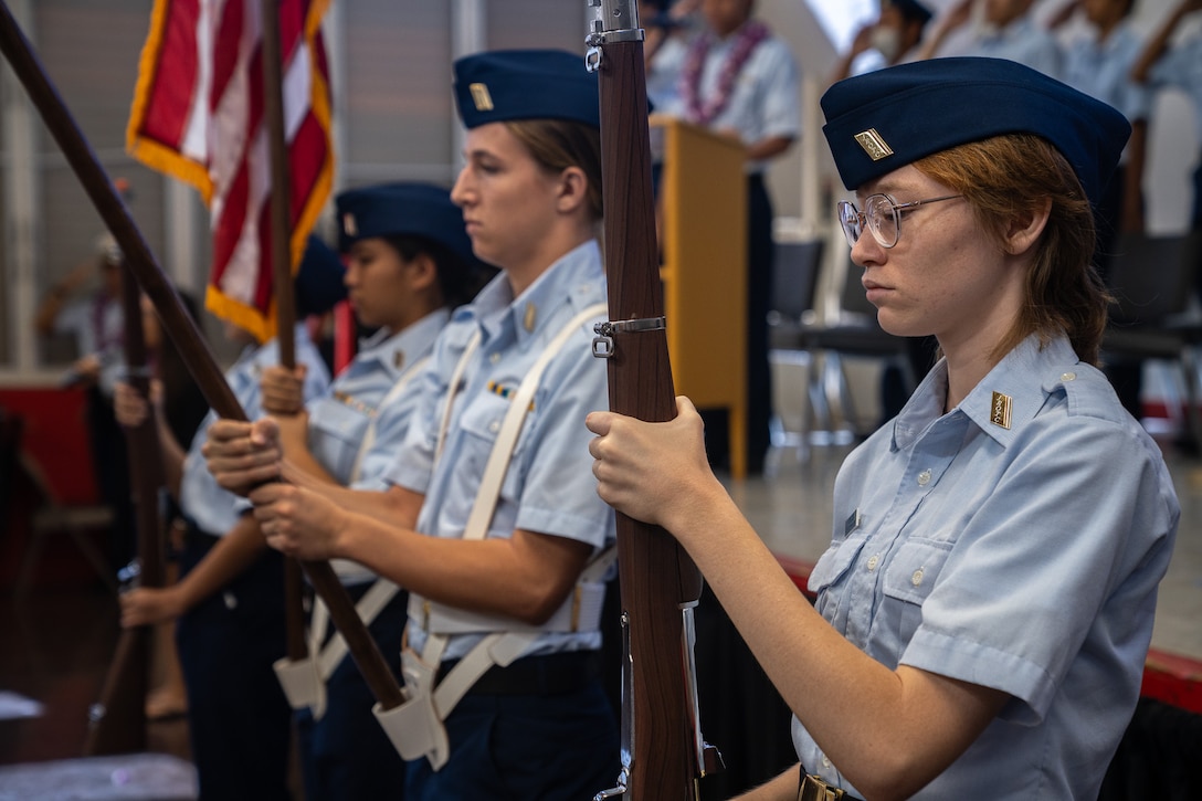 Cadets with the Kalani High School Coast Guard JROTC program present colors during the JROTC commissioning ceremony at the high school in Honolulu, Hawaii, Nov. 21, 2024. The Coast Guard established its first Hawaii-based JROTC at Kalani High School. (U.S. Coast Guard photo by Petty Officer 2nd Class Tyler Robertson)