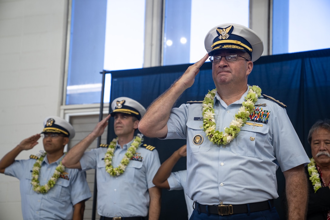 Coast Guard Rear Adm. Sean Regan, commander, District Fourteen, salutes during a ceremony at Kalani High School in Honolulu, Hawaii, Nov. 21, 2024. The Coast Guard established its first Hawaii-based JROTC unit, also the 14th Coast Guard JROTC in the U.S.  (U.S. Coast Guard photo by Petty Officer 2nd Class Tyler Robertson)