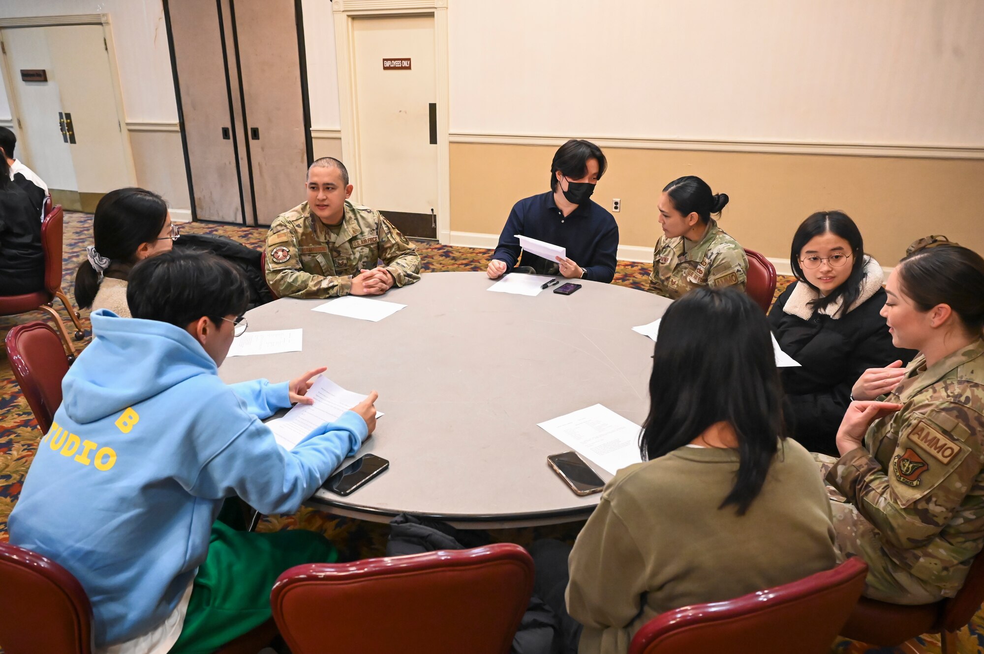 8th Fighter Wing Airmen speak with students from Kunsan National University at the Loring Club.