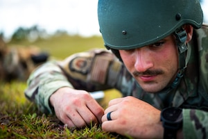 Air force troop laying in grass