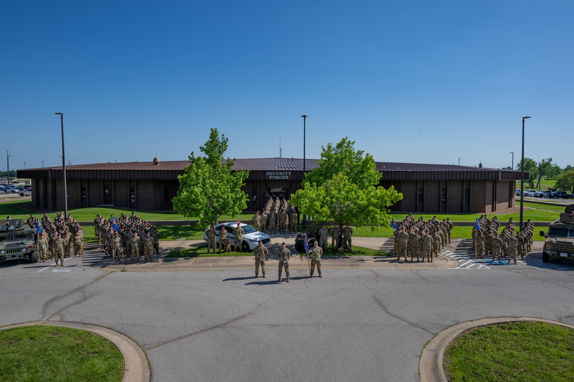 The 509th Security Forces Squadron pose outside the SFS building at Whiteman Air Force Base, Mo., May 24, 2024. (Air Force phot by Airman 1st Class Matthew S. Domingos)