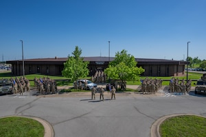 The 509th Security Forces Squadron pose outside the SFS building at Whiteman Air Force Base, Mo., May 24, 2024. (Air Force phot by Airman 1st Class Matthew S. Domingos)