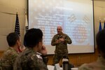 U.S. Air Force Lt. Col James Galyon, 51st Fighter Wing wing chaplain, provides a briefing during a Republic of Korea Air Force and U.S. Air Force  Chaplain Corps Readiness Symposium at Osan Air Base, ROK, Nov. 14, 2024. The symposium invited chaplains from Kunsan AB and ROKAF units to discuss contingency and bilateral operations to improve spiritual readiness across the peninsula. (U.S. Air Force photo by Tech. Sgt. Clayton Lenhardt)