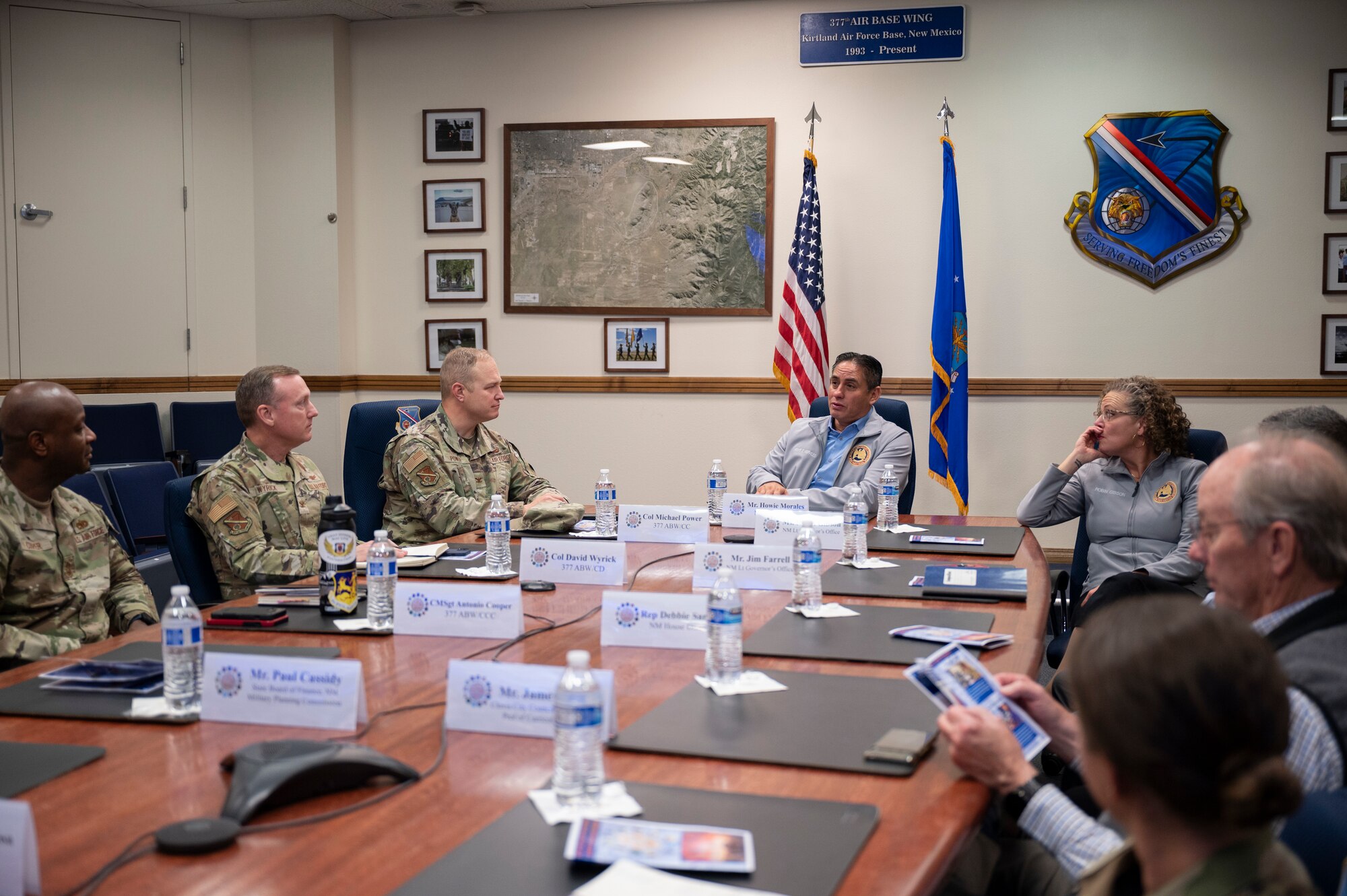 A group listens to a brief.