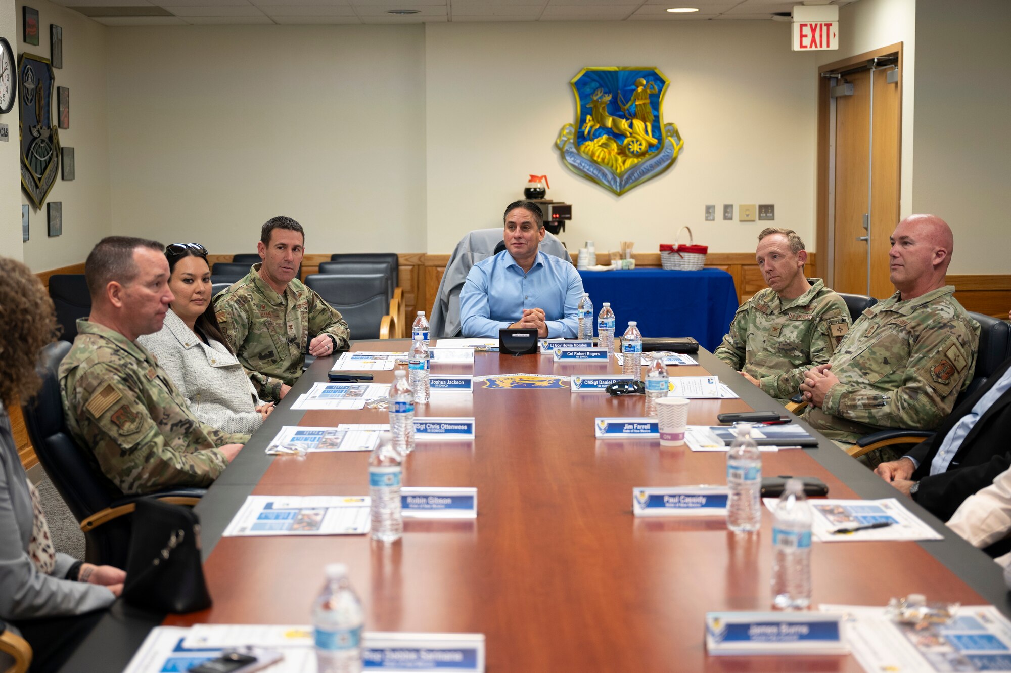 A group listens to a brief.