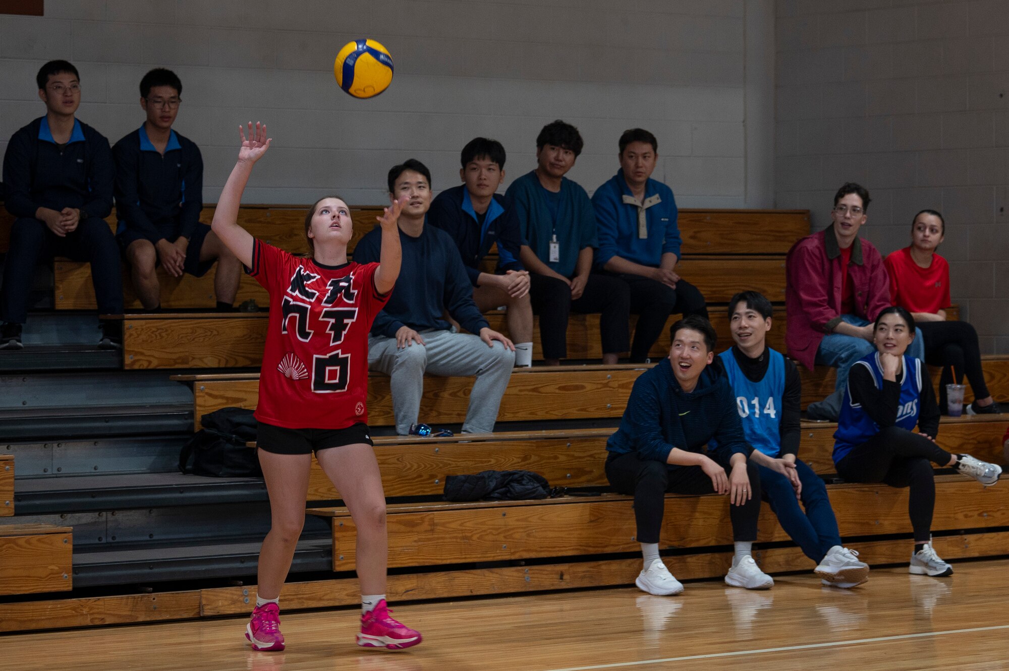 A U.S. Air Force member assigned to Osan Air Base serves a volleyball during the Republic of Korea-U.S. sports day at Osan AB, ROK, Nov. 15, 2024. Members competed to earn the most points throughout five sporting events with the support and encouragement of their teammates. Members from the U.S. intelligence community gather with their ROK partners throughout the year for continued camaraderie within the career field. (U.S. Air Force photo by Staff Sgt. Ashley N. Mikaio)