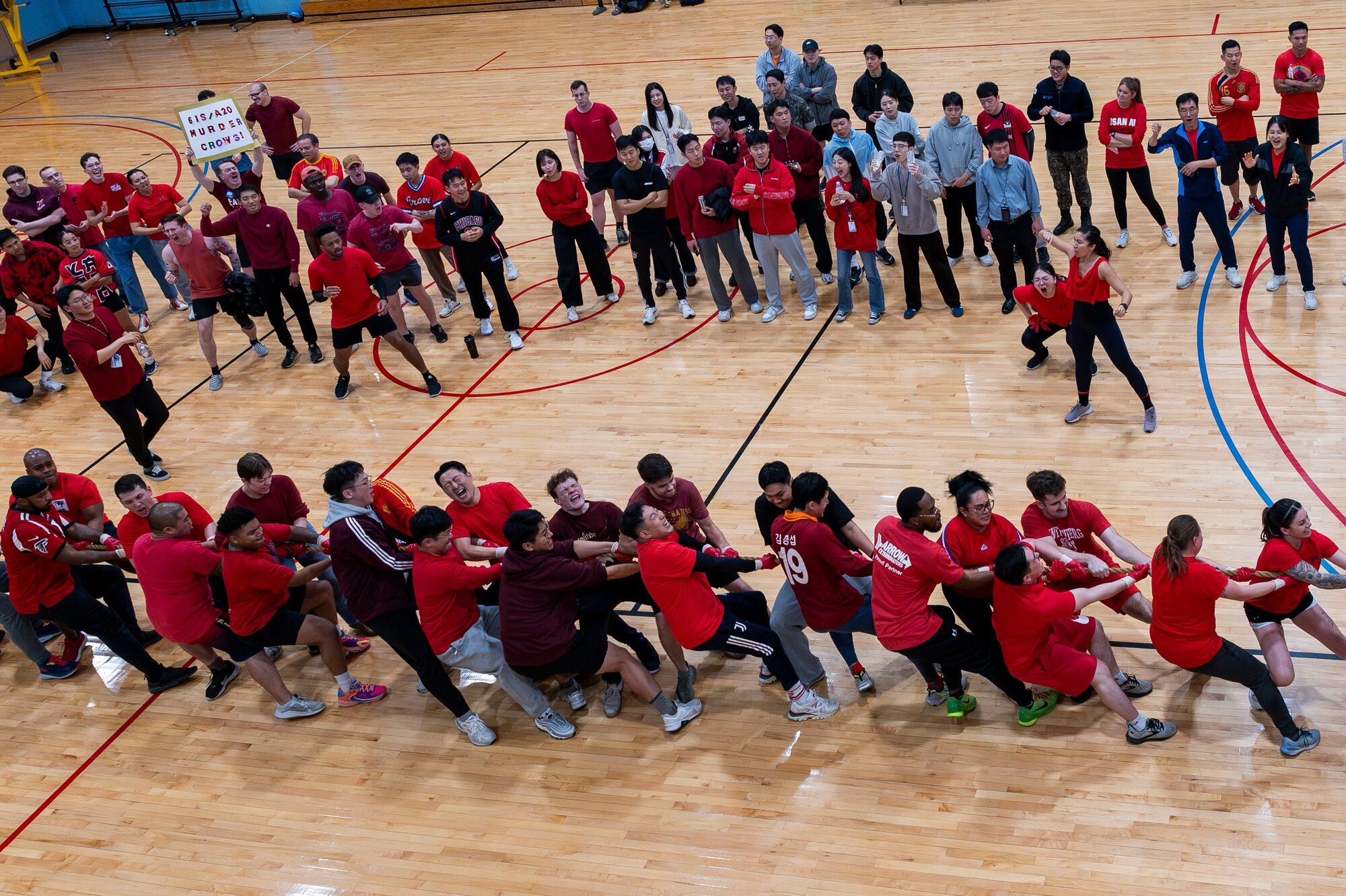 U.S. Air Force members assigned to Osan Air Base and Republic of Korea Air Force members participate in a tug-of-war during a semi-annual intelligence sports day at Osan AB, ROK, Nov. 15, 2024. Members participated in five sporting events throughout the afternoon to ultimately crown a winning team. Members from the U.S. intelligence community get together with their ROK partners throughout the year for continued camaraderie and partnership within the career field. (U.S. Air Force photo by Staff Sgt. Ashley N. Mikaio)