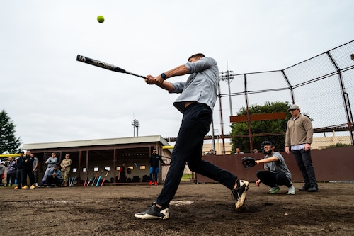 Person swinging a bat