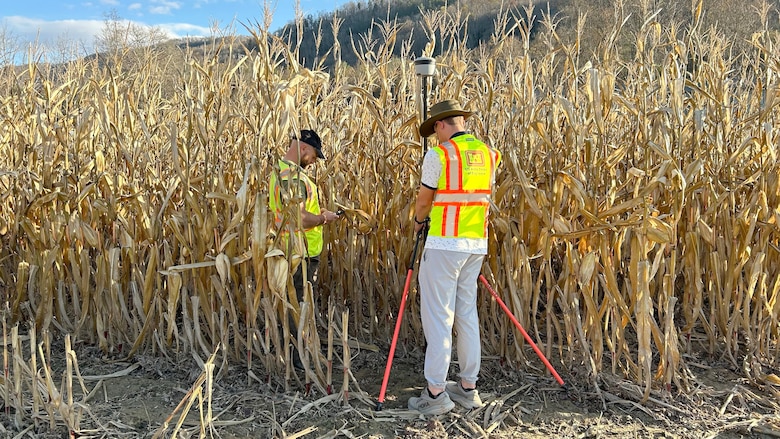 Mike Light (Left) and Mark Veasey, members of a U.S. Army Corps of Engineers Nashville District High-Water Marks Team, records a high-water mark Nov. 8, 2024, on corn stalks along Hoopers Creek near Goodluck, North Carolina. This area flooded during Hurricane Helene. (USACE Photo by Patrick Garner)