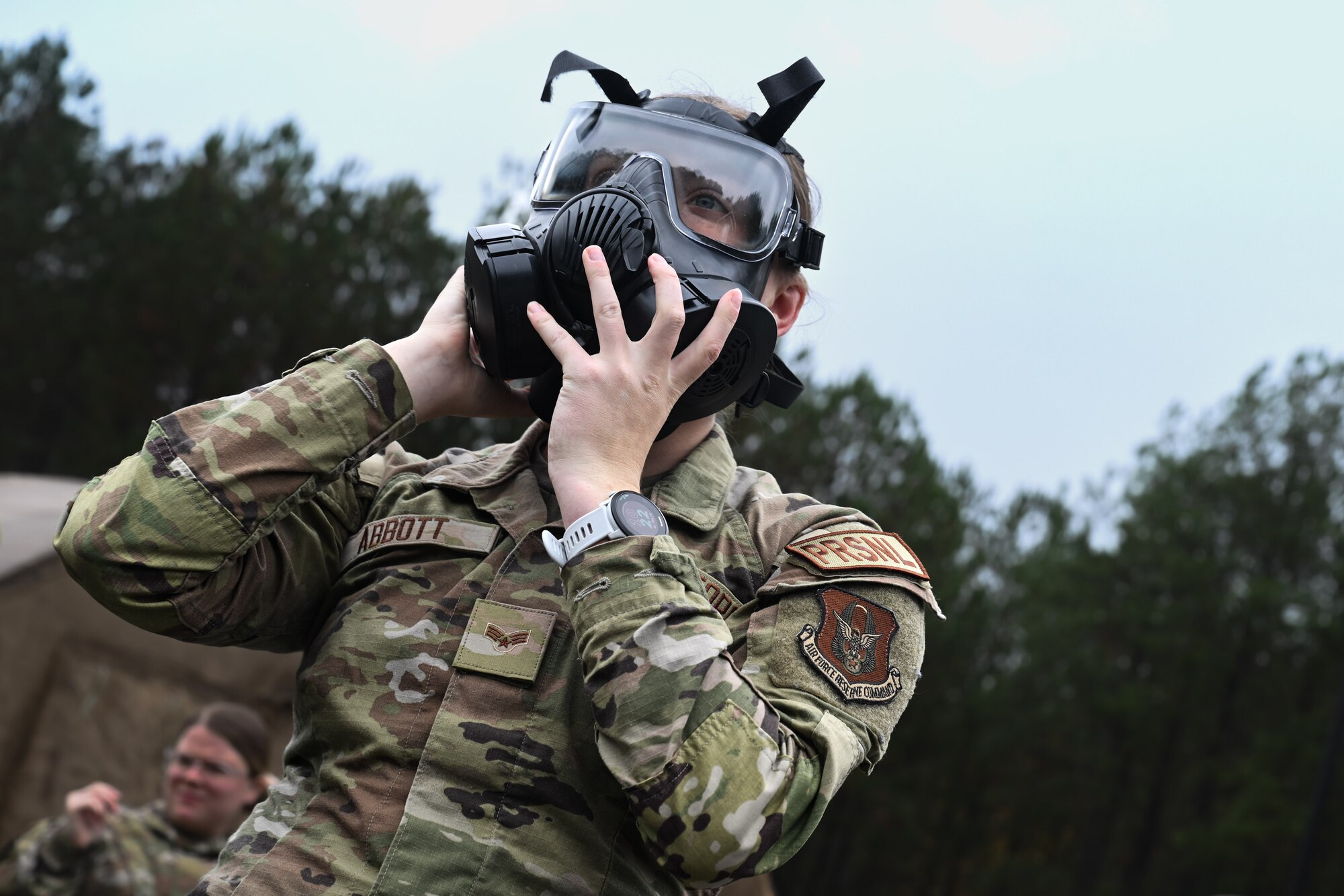 A Citizen Airman assigned to the 910th Airlift Wing adjusts their gas mask during a Chemical, Biological, Radiological, Nuclear and high-yield Explosives class at Dobbins Air Reserve Base, Georgia, Nov. 14, 2024.