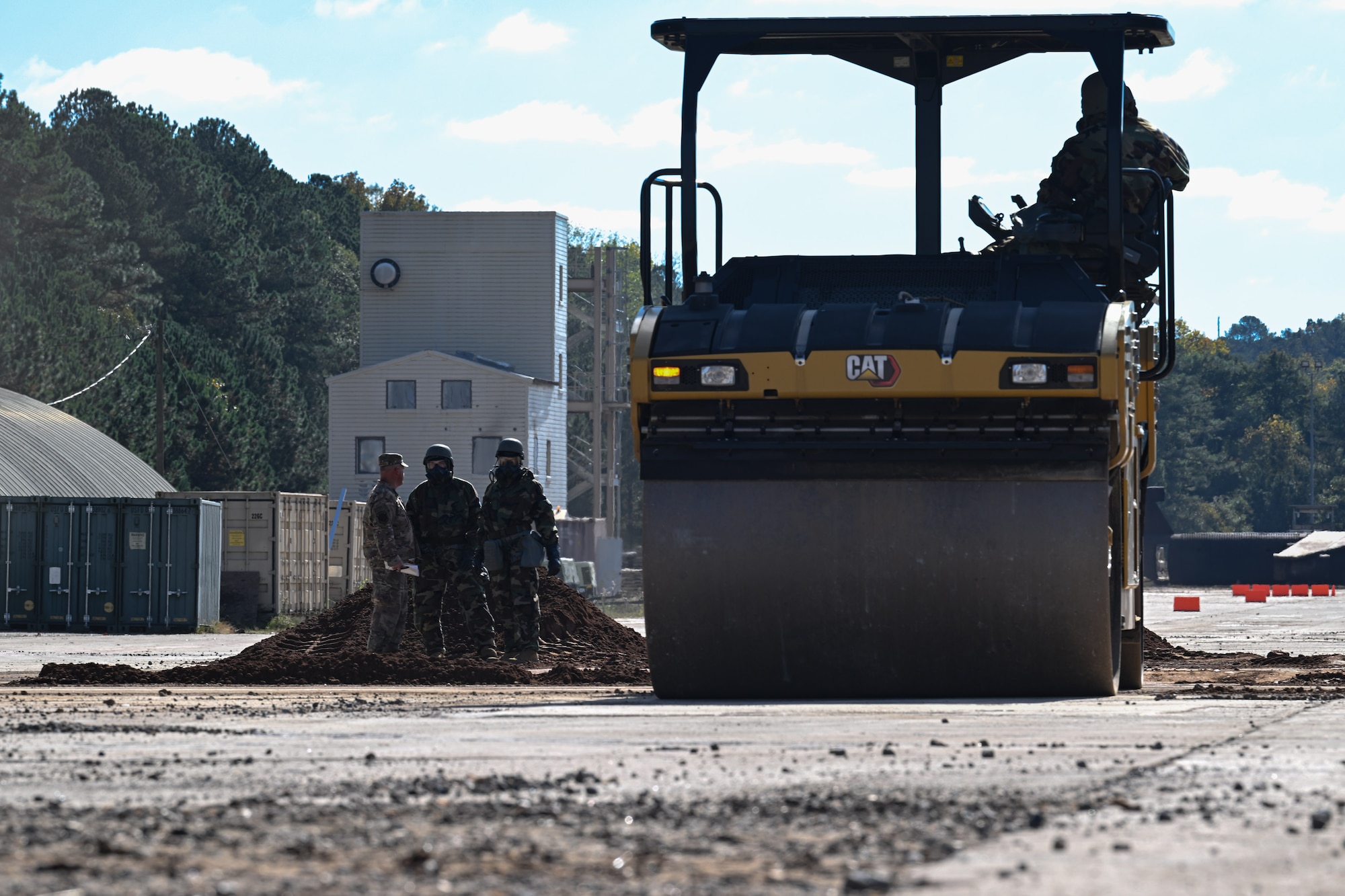 Citizen Airmen assigned to the 910th Civil Engineer Squadron operate heavy machinery while in mission-oriented protective posture gear at Dobbins Air Reserve Base, Georgia, Nov. 15, 2024.