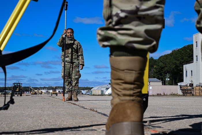A Citizen Airman assigned to the 910th Civil Engineer Squadron assists in surveying the elevation of the practice flightline at Dobbins Air Reserve Base, Georgia, Nov. 15, 2024.