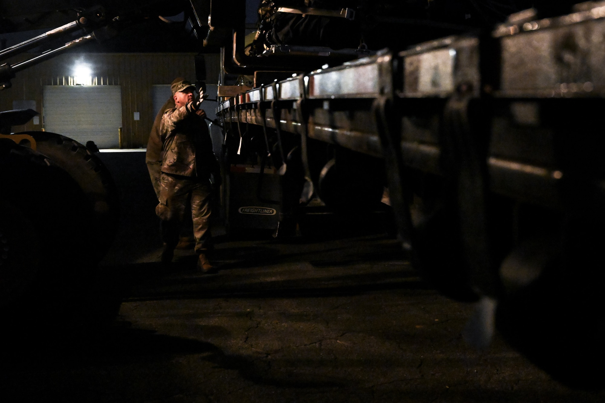 A Citizen Airman assigned to the 910th Civil Engineer Squadron assists in loading cargo onto a flatbed trailer at Dobbins Air Reserve Base, Georgia, Nov. 16, 2024.