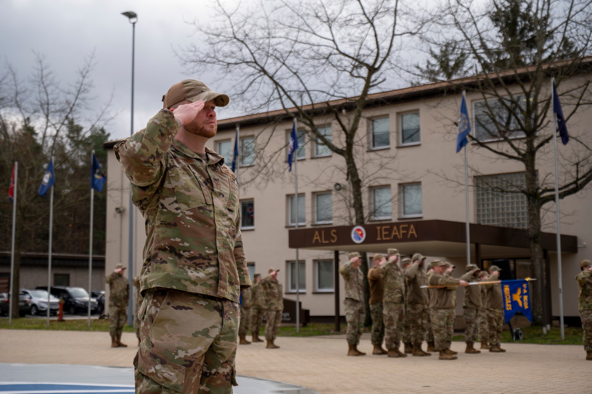 U.S. Air Force Tech. Sgt. Luke Hodge, 86th Vehicle Readiness Squadron material control section chief, leads a salute at Kapaun Air Station, Germany, Nov. 21, 2024.