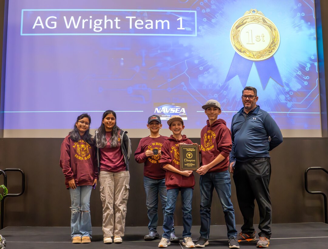 The team from A.G. Wright Middle School celebrates their first-place victory at the Middle School Innovation Challenge @ Dahlgren, showcasing exceptional robotics and STEM skills throughout the competition. (Morgan Tabor/NSWCDD)