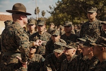 U.S. Marine Corps recruits with Echo Company, 2nd Recruit Training Battalion, listen to their drill instructor during a post exchange and haircut call at Marine Corps Recruit Depot San Diego, California, Nov. 18, 2024. Recruits are allowed to go to the PX to buy necessary supplies and receive haircuts weekly during their time at MCRD San Diego in order to maintain a uniform appearance and promote good hygiene throughout recruit training. (U.S. Marine Corps photo by Lance Cpl. Janell B. Alvarez)