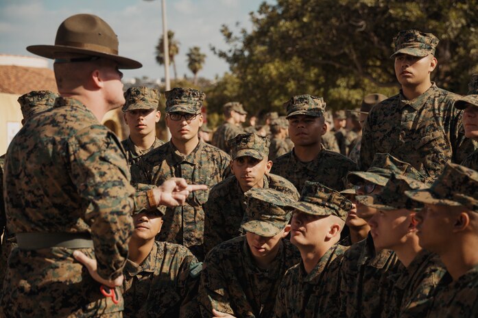 U.S. Marine Corps recruits with Echo Company, 2nd Recruit Training Battalion, listen to their drill instructor during a post exchange and haircut call at Marine Corps Recruit Depot San Diego, California, Nov. 18, 2024. Recruits are allowed to go to the PX to buy necessary supplies and receive haircuts weekly during their time at MCRD San Diego in order to maintain a uniform appearance and promote good hygiene throughout recruit training. (U.S. Marine Corps photo by Lance Cpl. Janell B. Alvarez)