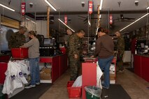 U.S. Marine Corps recruits with Echo Company, 2nd Recruit Training Battalion, purchase items during a post exchange and haircut call at Marine Corps Recruit Depot San Diego, California, Nov. 18, 2024. Recruits are allowed to go to the PX to buy necessary supplies and receive haircuts weekly during their time at MCRD San Diego in order to maintain a uniform appearance and promote good hygiene throughout recruit training. (U.S. Marine Corps photo by Lance Cpl. Janell B. Alvarez)