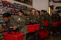 U.S. Marine Corps recruits with Echo Company, 2nd Recruit Training Battalion, search for items during a post exchange and haircut call at Marine Corps Recruit Depot San Diego, California, Nov. 18, 2024. Recruits are allowed to go to the PX to buy necessary supplies and receive haircuts weekly during their time at MCRD San Diego in order to maintain a uniform appearance and promote good hygiene throughout recruit training. (U.S. Marine Corps photo by Lance Cpl. Janell B. Alvarez)