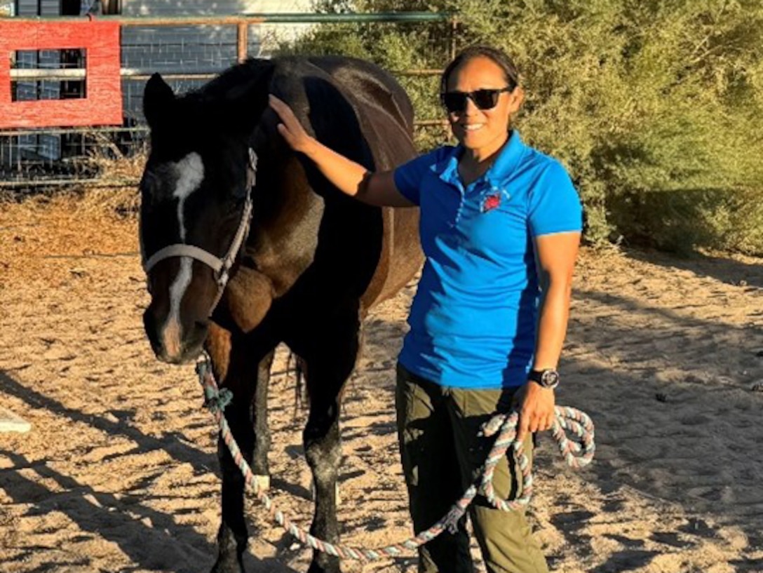 Capt. Kyra Maggio enjoys caring for horses as part of her therapy at the Fort Bliss SRU.