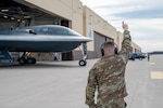 A U.S. Air Force crew chief assigned to the 131st Maintenance Group marshals a B-2 Spirit stealth bomber on the flight line at Whiteman Air Force Base, Missouri, Feb. 1, 2024, Missouri Air National Guard Airmen work side-by-side with their regular Air Force counterparts to ensure B-2s are ready to fly at a moment’s notice.