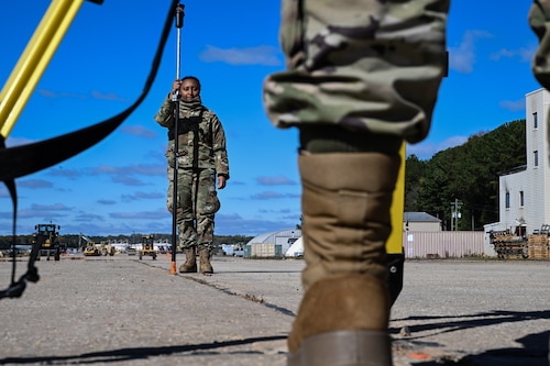 A Citizen Airman assigned to the 910th Civil Engineer Squadron assists in surveying the elevation of the practice flightline at Dobbins Air Reserve Base, Georgia, Nov. 15, 2024.