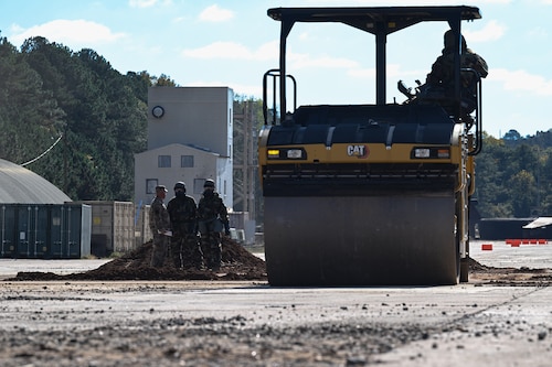 Citizen Airmen assigned to the 910th Civil Engineer Squadron operate heavy machinery while in mission-oriented protective posture gear at Dobbins Air Reserve Base, Georgia, Nov. 15, 2024.