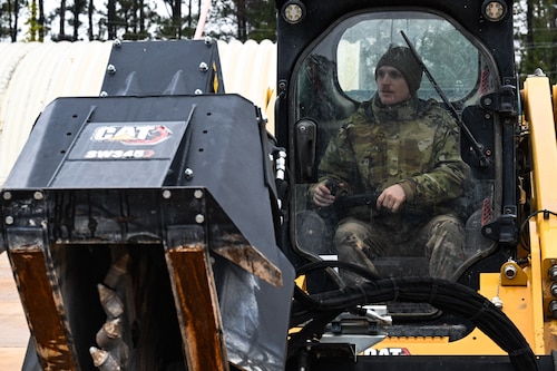 A Citizen Airman assigned to the 910th Civil Engineer Squadron operates a skid steer loader at Dobbins Air Reserve Base, Georgia, Nov. 14, 2024.