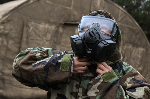 A Citizen Airman assigned to the 910th Airlift Wing adjusts their gas mask during a Chemical, Biological, Radiological, Nuclear and high-yield Explosives class at Dobbins Air Reserve Base, Georgia, Nov. 14, 2024.