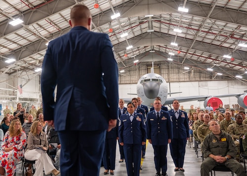 military members stand at attention