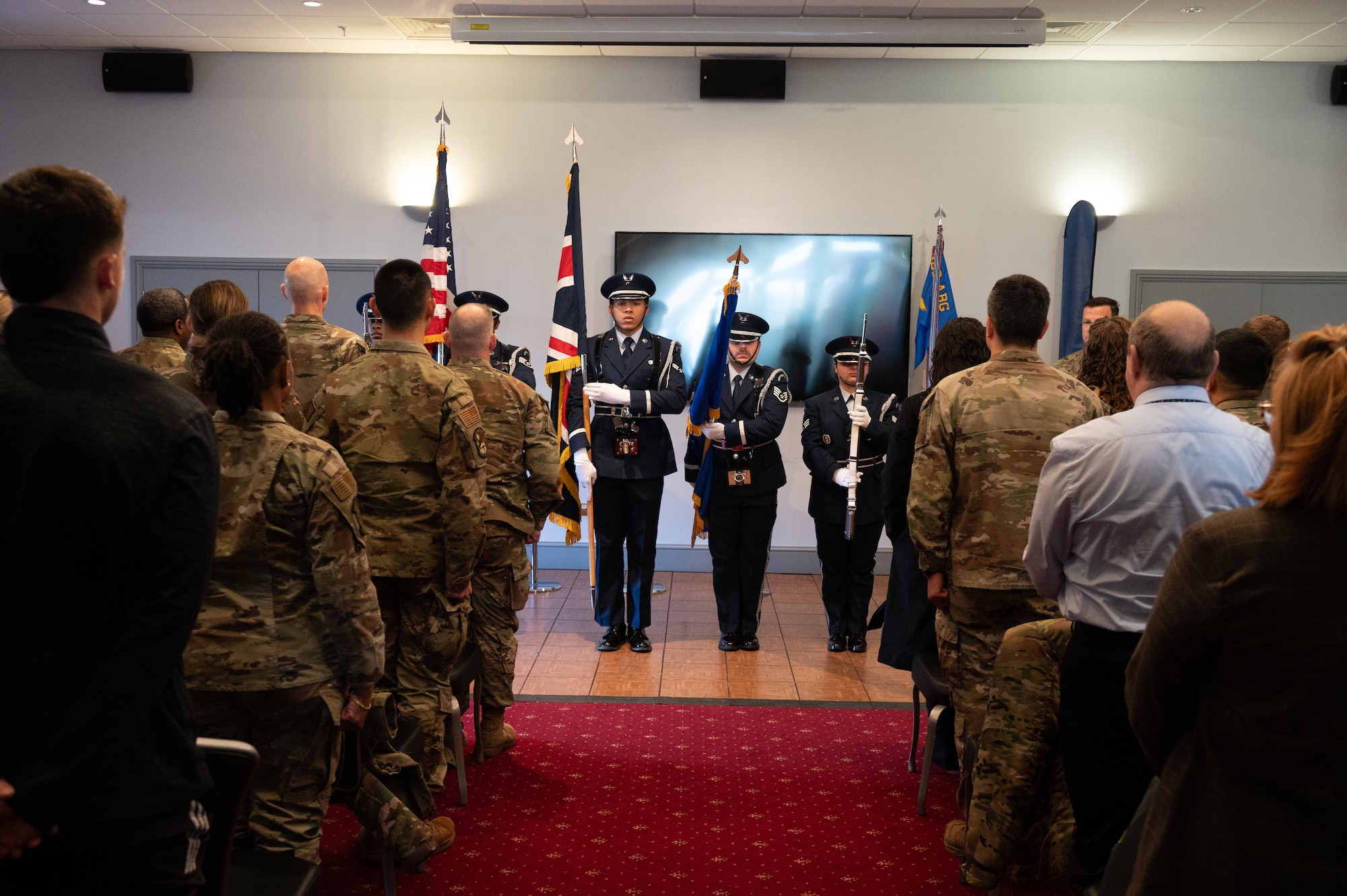Base honor guardsmen present the colors