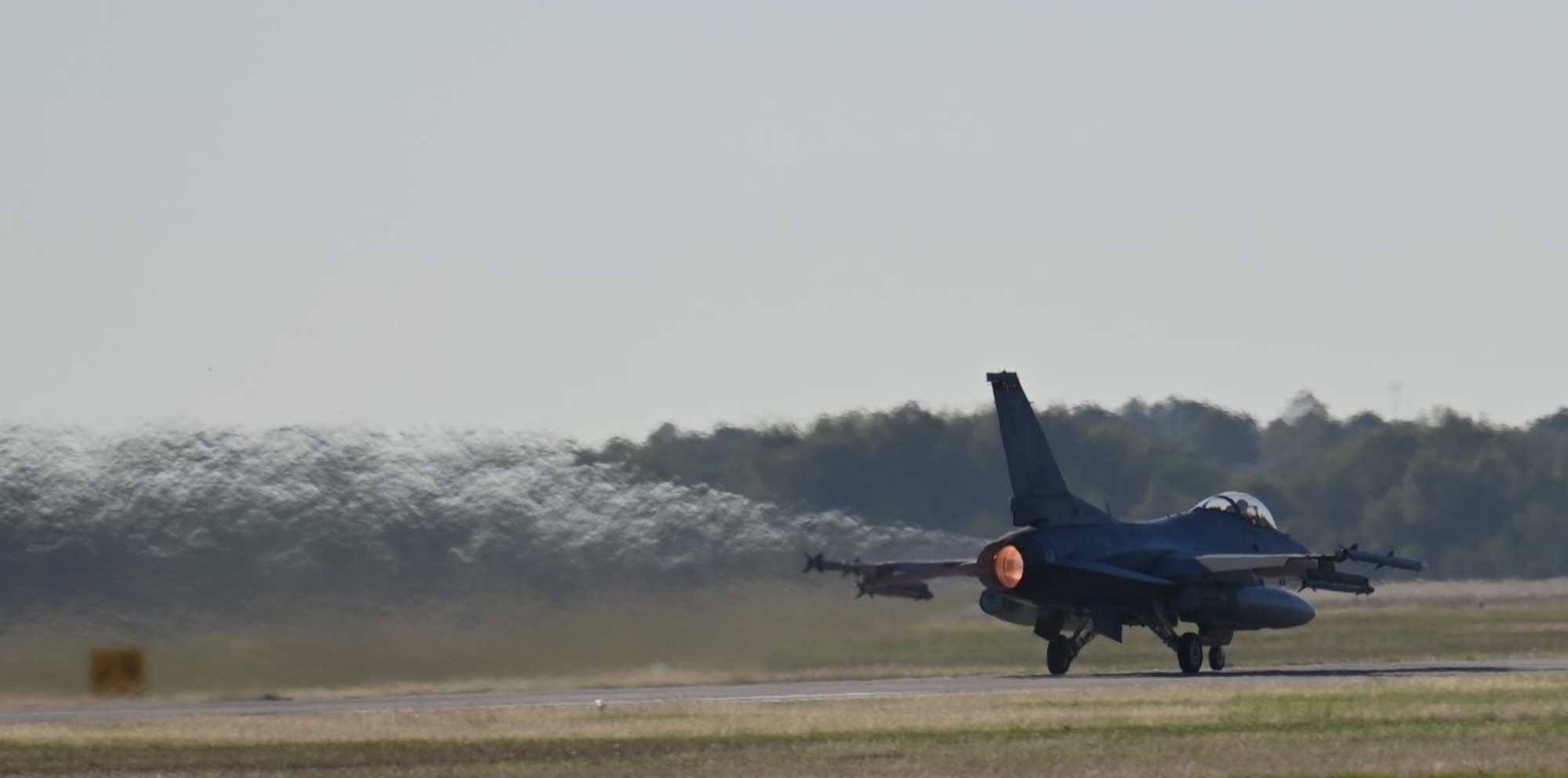 Photos of airplanes and crews participating in AMALGAM EAGLE 2024, a live-fly air defense exercise