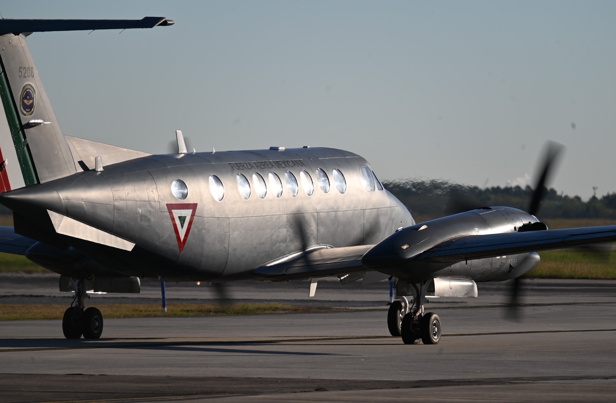 Photos of airplanes and crews participating in AMALGAM EAGLE 2024, a live-fly air defense exercise