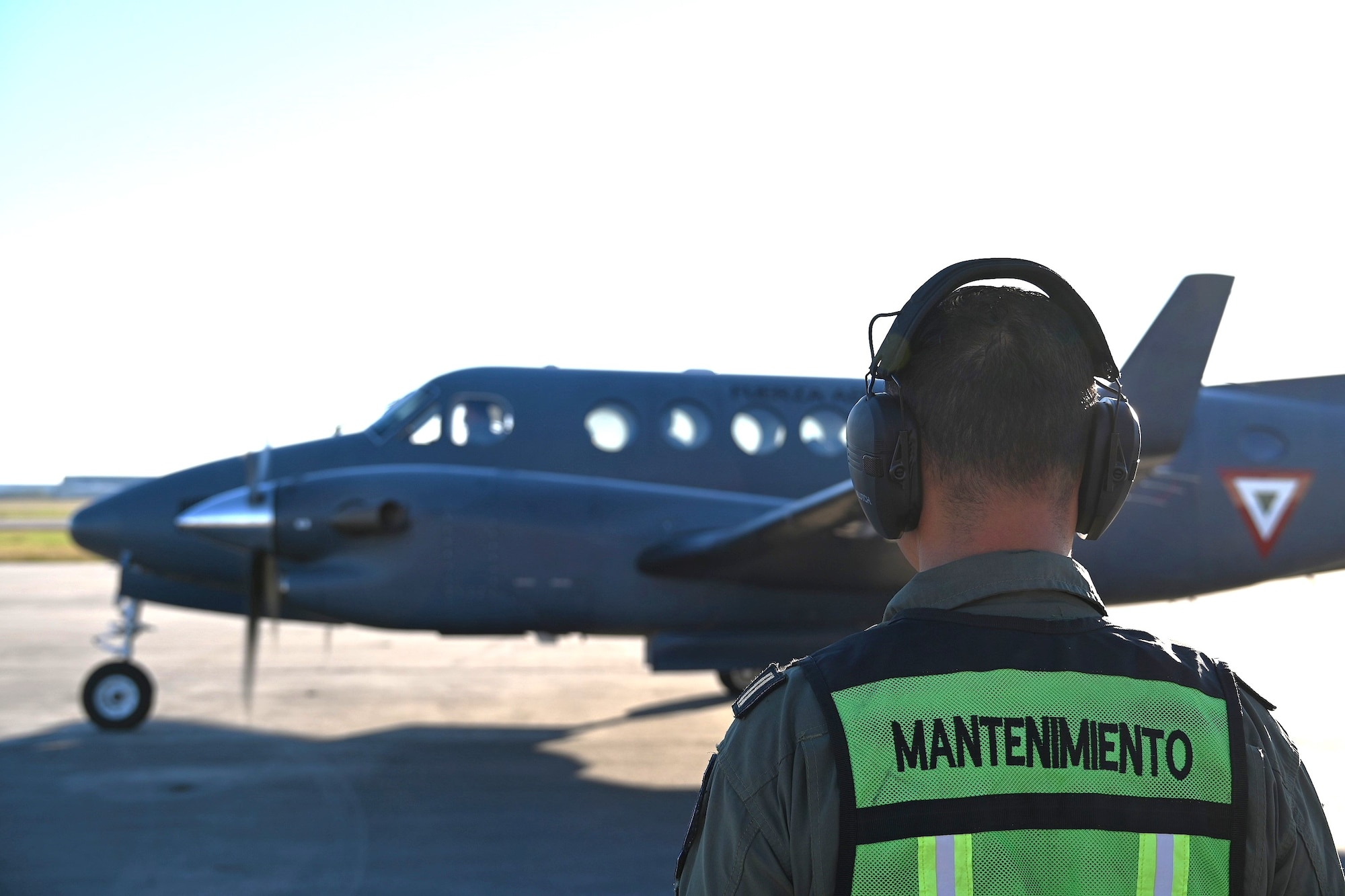Photos of airplanes and crews participating in AMALGAM EAGLE 2024, a live-fly air defense exercise