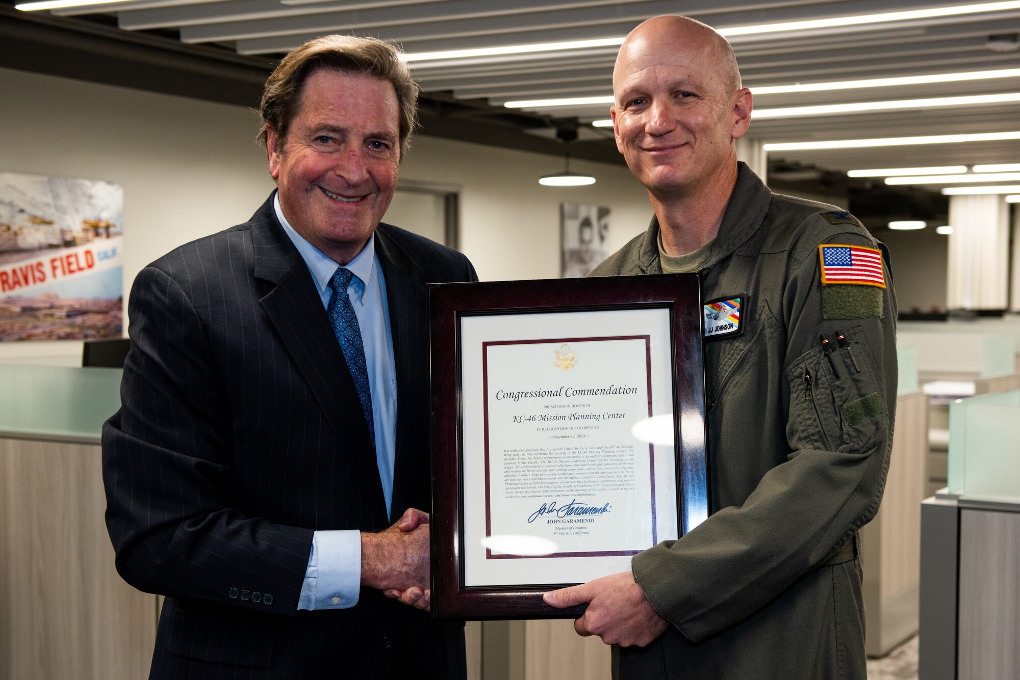 Congressman presenting commendation to Air Wing commander