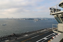 Sailors man the rails on the flight deck as Nimitz-class aircraft carrier USS George Washington (CVN 73), returns to Commander, Fleet Activities Yokosuka, Japan, Nov. 22, 2024.