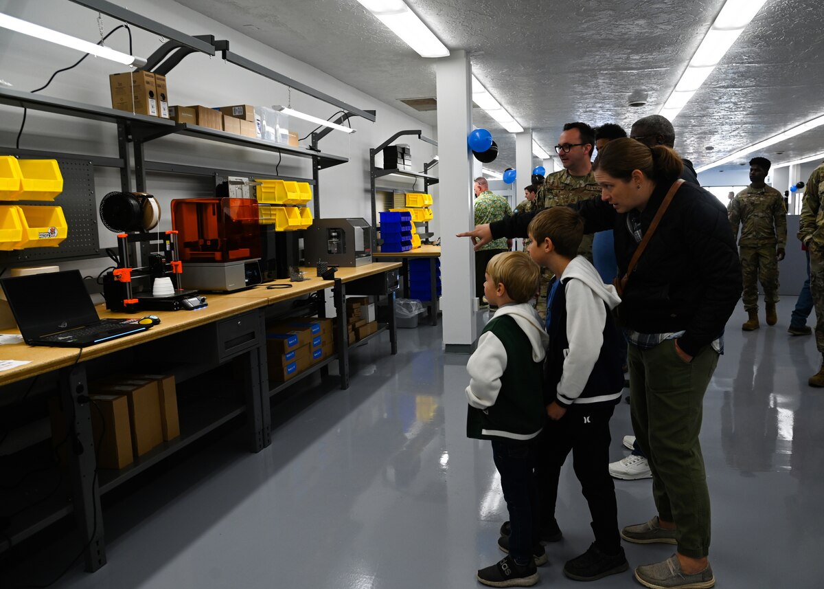 members explore the new innovation lab, which has couches, whiteboards,  and 3d printers
