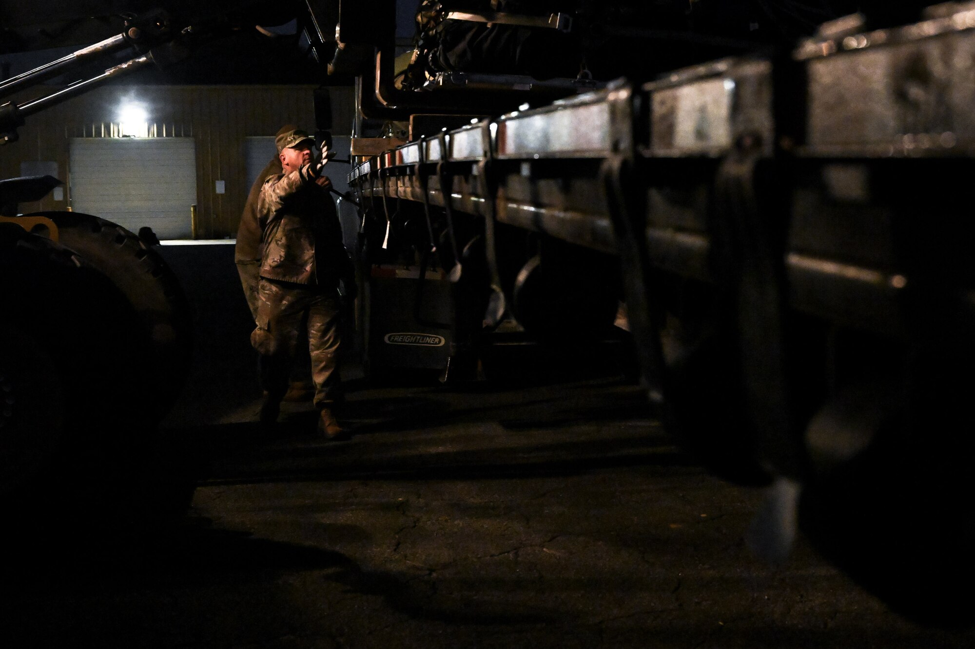 A Citizen Airman assigned to the 910th Civil Engineer Squadron assists in loading cargo onto a flatbed trailer at Dobbins Air Reserve Base, Georgia, Nov. 16, 2024.