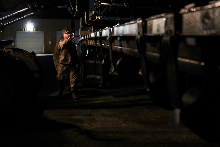 A Citizen Airman assigned to the 910th Civil Engineer Squadron assists in loading cargo onto a flatbed trailer at Dobbins Air Reserve Base, Georgia, Nov. 16, 2024.