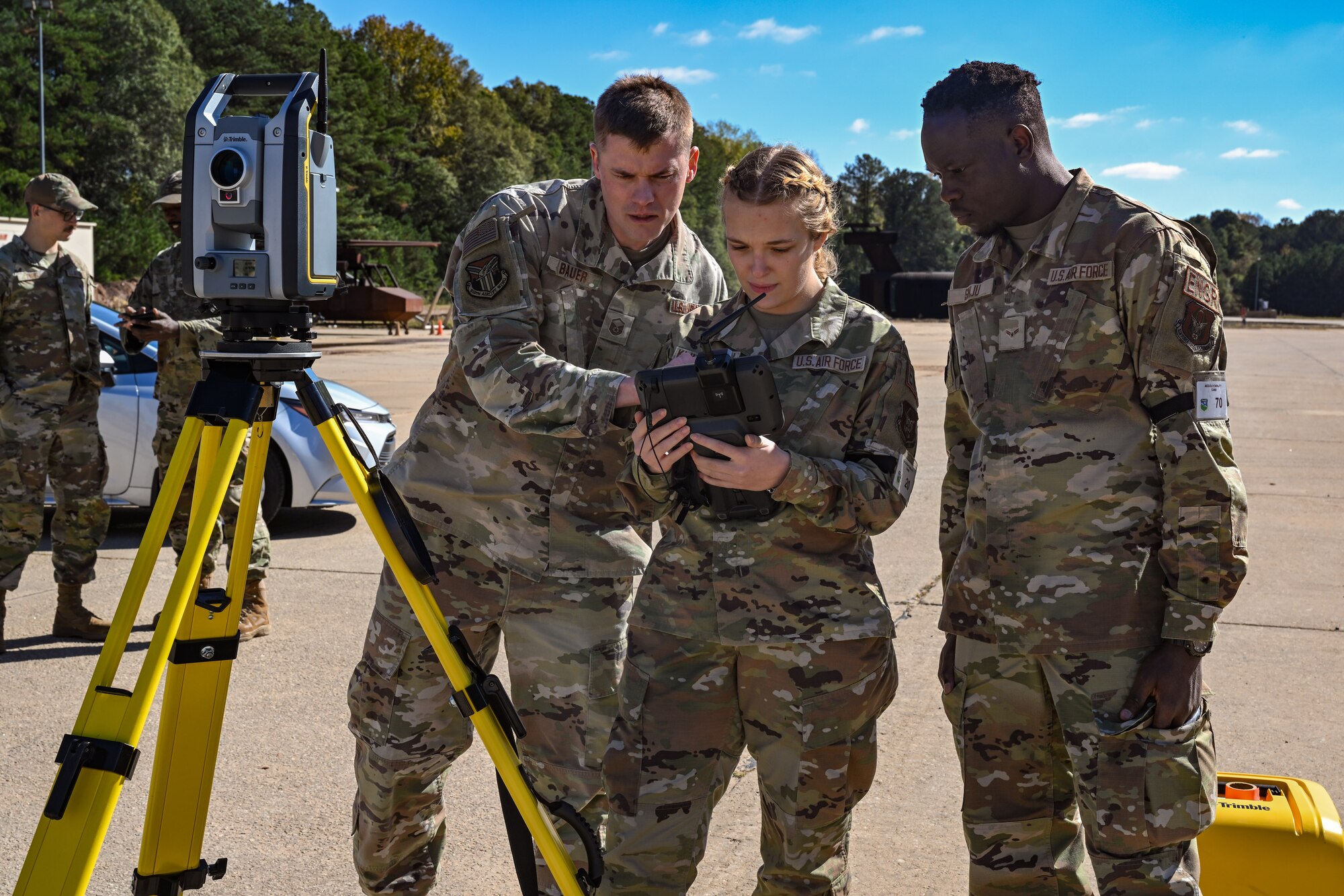 Citizen Airmen assigned to the 910th Civil Engineer Squadron operate surveying equipment for evaluating the elevation of the practice flightline at Dobbins Air Reserve Base, Georgia, Nov. 15, 2024.