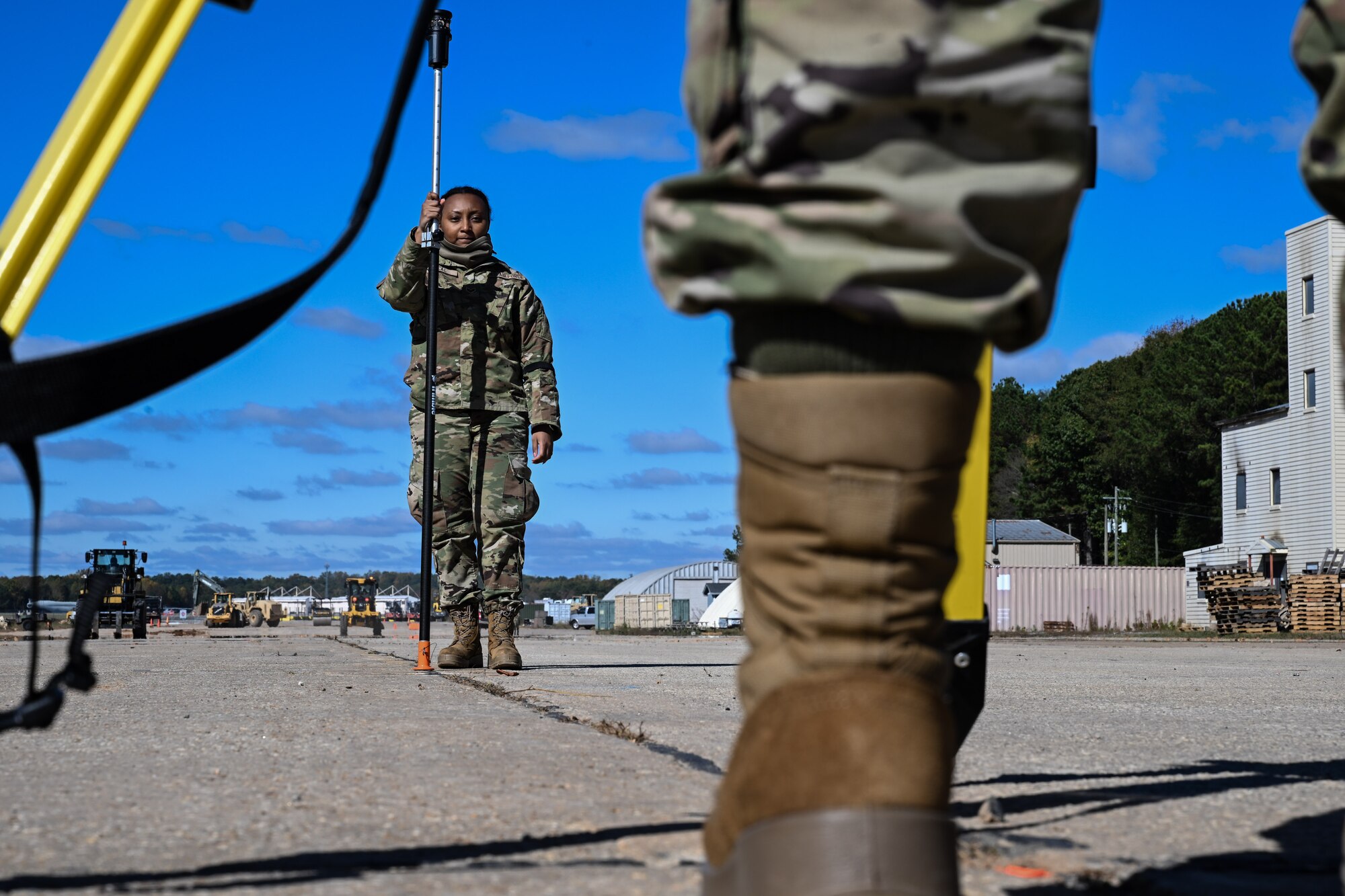 A Citizen Airman assigned to the 910th Civil Engineer Squadron assists in surveying the elevation of the practice flightline at Dobbins Air Reserve Base, Georgia, Nov. 15, 2024.