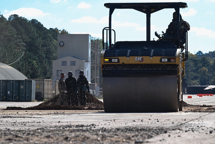 Citizen Airmen assigned to the 910th Civil Engineer Squadron operate heavy machinery while in mission-oriented protective posture gear at Dobbins Air Reserve Base, Georgia, Nov. 15, 2024.