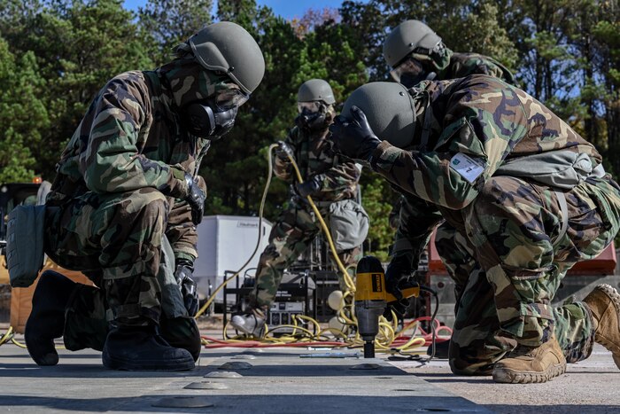 Citizen Airmen assigned to the 910th Civil Engineer Squadron operate equipment while in mission-oriented protective posture gear at Dobbins Air Reserve Base, Georgia, Nov. 15, 2024.