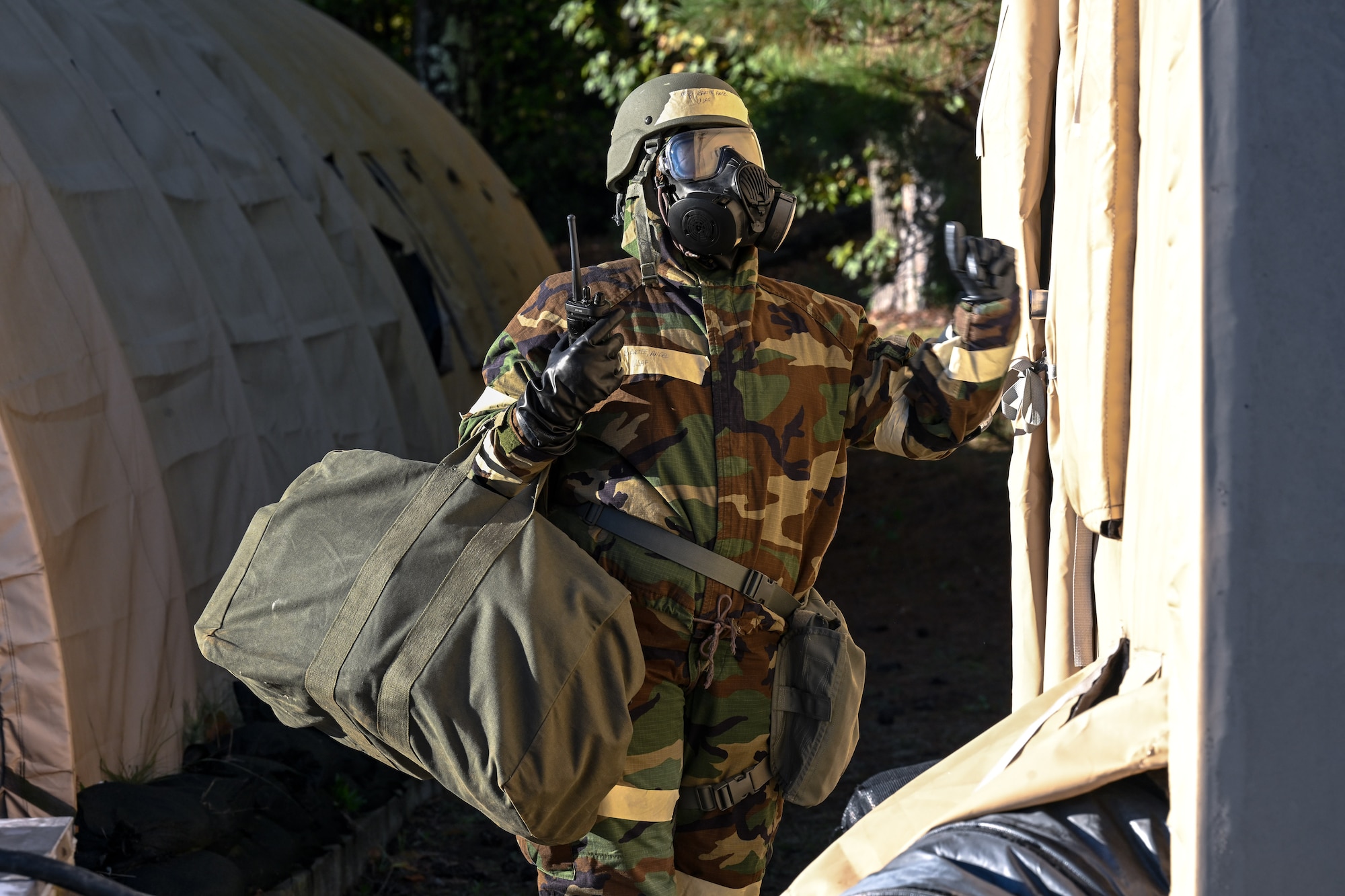 A Citizen Airman assigned to the 910th Airlift Wing knocks on a tent door during a Chemical, Biological, Radiological, Nuclear and high-yield Explosives exercise at Dobbins Air Reserve Base, Georgia, Nov. 15, 2024.