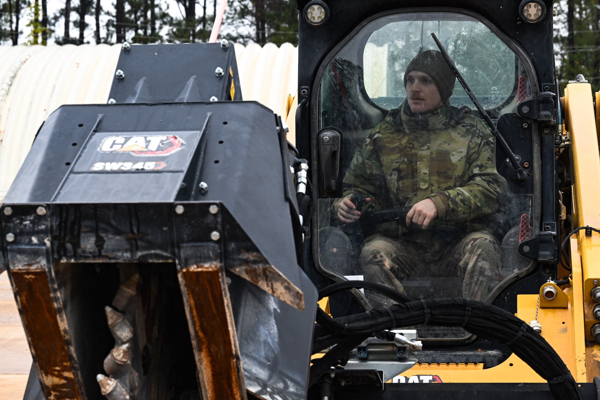 A Citizen Airman assigned to the 910th Civil Engineer Squadron operates a skid steer loader at Dobbins Air Reserve Base, Georgia, Nov. 14, 2024.