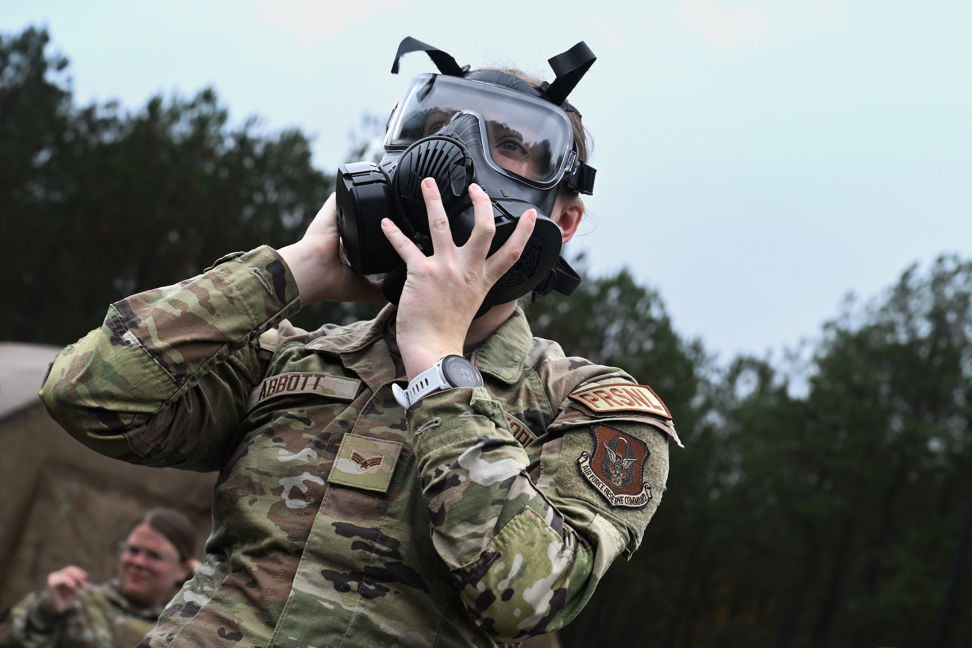 A Citizen Airman assigned to the 910th Airlift Wing adjusts their gas mask during a Chemical, Biological, Radiological, Nuclear and high-yield Explosives class at Dobbins Air Reserve Base, Georgia, Nov. 14, 2024.