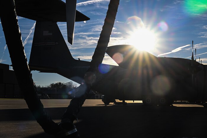 The sun rises behind a C-130H Hercules at Youngstown Air Reserve Station, Ohio, Nov. 13, 2024.