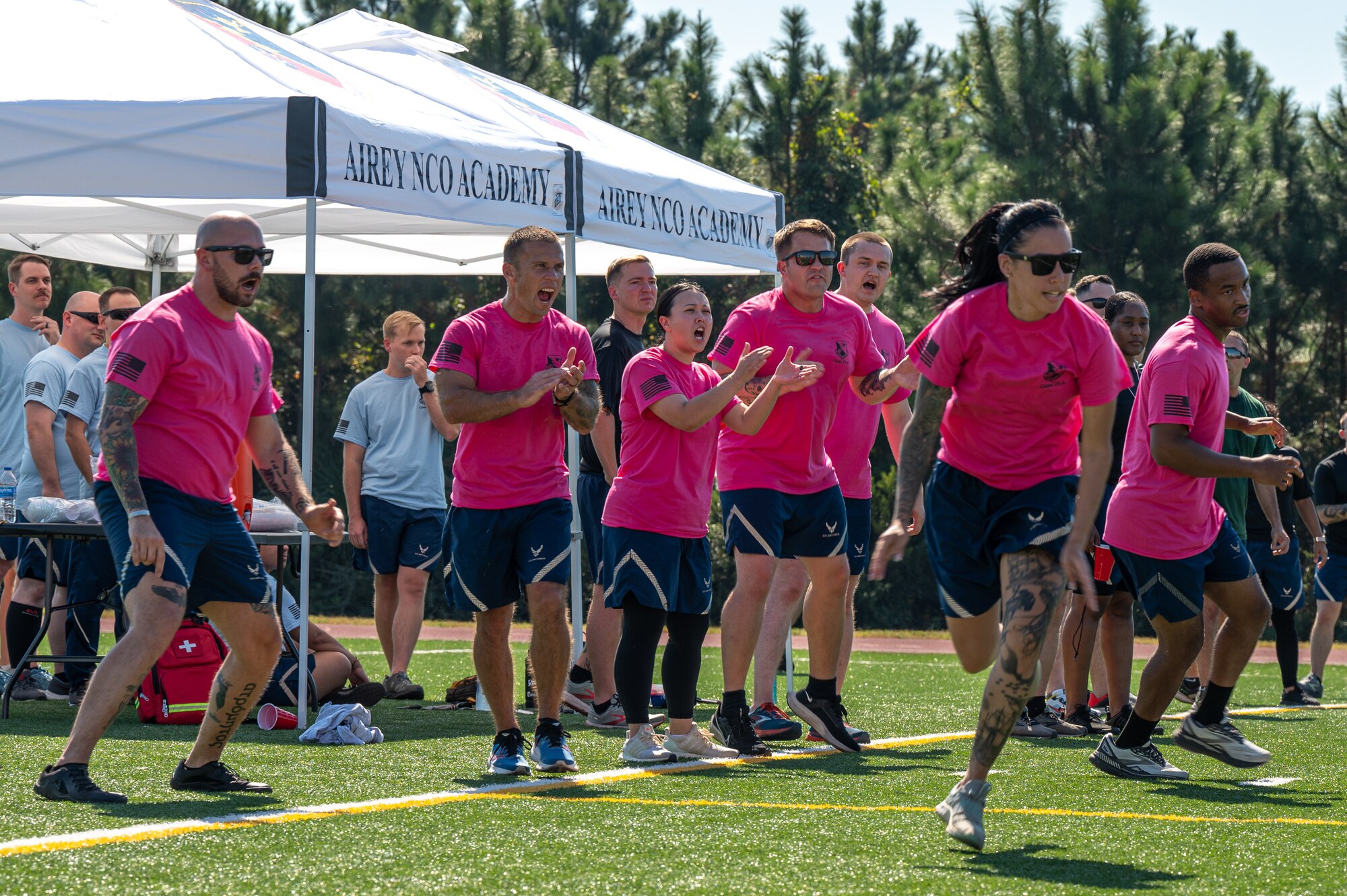 Fellow Airmen cheer on their team mate during a game of ultimate frisbee